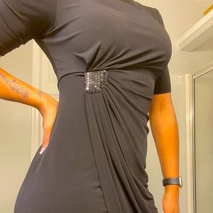 Sleek black dress, ready to impress. Great material & nice color, ladies size 6